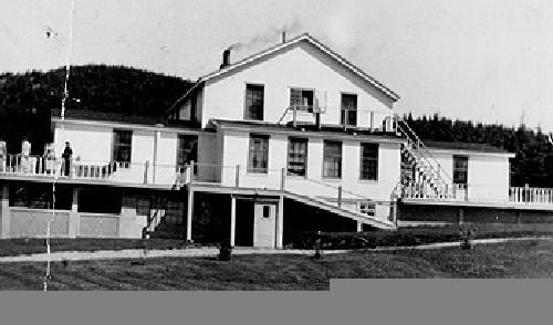 Exterior front facade view of Bonne Bay Cottage Hospital, Norris Point, Newfoundland, 1953.; Boyd Bugden
