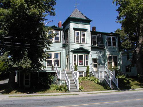 James Simmonds House, projecting two storey square bay with pediment over three paned first storey window, hooded second storey double window, street level basement, Dartmouth, Nova Scotia, 2005.; Heritage Division, NS Dept. of Tourism, Culture and Heritage, 2005