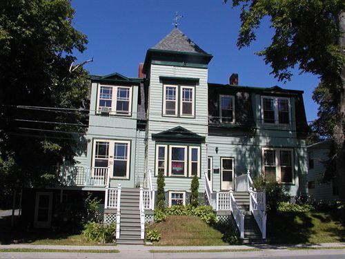 James Simmonds House, pediment over second storey double windows, mansard roof, two chimneys, assymetrical facade, shingle and clap board siding, Dartmouth, Nova Scotia, 2005.; Heritage Division, NS Dept. of Tourism, Culture and Heritage, 2005.
