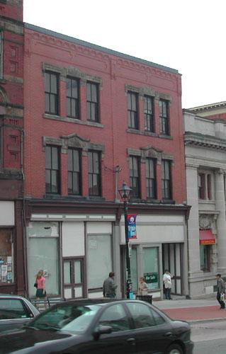 This photograph shows the contextual view of the building and its proximity to the other buildings on the slope of King street, 2004; City of Saint John