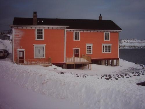 Exterior photo of the Hodge Brother's Premises showing side facade and orientation directly at the water's edge, under restoration, 2006.; HFNL 2006