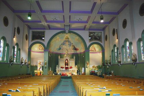 View down the nave of  St. Edward the Confessor Roman Catholic Church, Winnipeg, 2005; Historic Resources Branch, Manitoba Culture, Heritage and Tourism, 2005