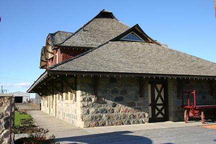 View of southeast corner emphasizing the fieldstone construction and the impressive roof composition of the Virden Canadian Pacific Railway Station, Virden, 2005; Historic Resources Branch, Manitoba Culture, Heritage and Tourism 2005