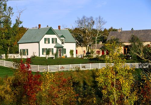 General view of L.M. Montgomery's Cavendish, showing its setting among wooded groves, pathways and rolling agricultural fields.; Parks Canada Agency / Agence Parcs Canada.