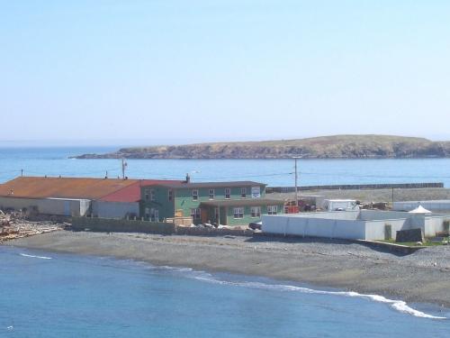 View of the Bernard Kavanagh Premises, Ferryland, NL looking southeast from the Southern Shore Highway. Photo taken May 2006. ; HFNL/Andrea O'Brien 2006