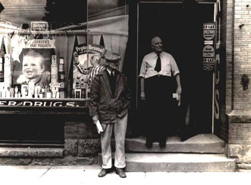 Georges Léger outside of his pharmacy.; CÉA