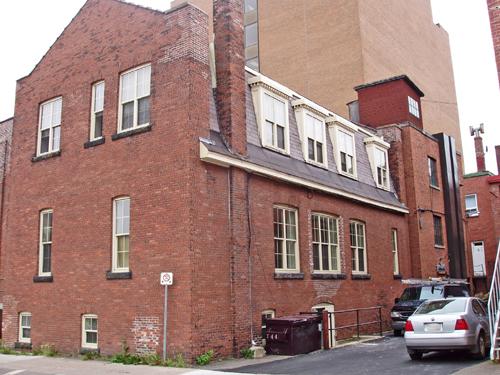 One of the Central School Buildings, moved to Church Street from Alma Street in 1898, is still distinguishable at the rear of the Salvation Army Citadel.; Moncton Museum