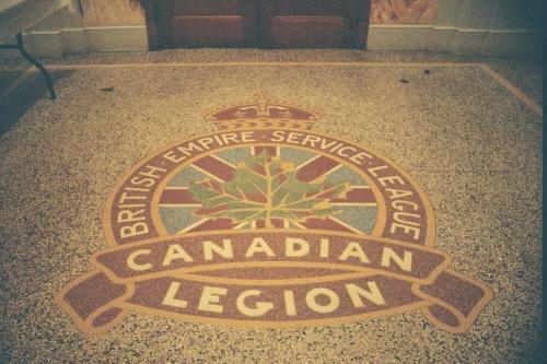 Royal Canadian Legion crest on foyer's terrazzo floor, 2005.; Ross Herrington, 2005.