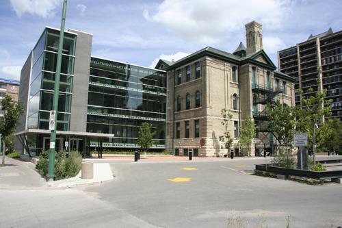 Context view, from the southwest, showing the original Isbister School and the modern addition on the left, Winnipeg, 2006; Historic Resources Branch, Manitoba Culture, Heritage, Tourism and Sport, 2006