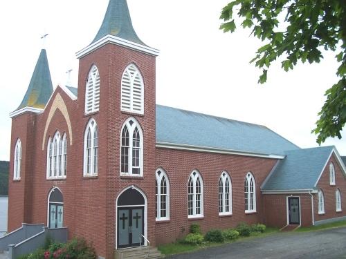 View of eastern and northerm facades of Immaculate Conception Church, Cape Broyle, NL. Photo taken July 2006. ; HFNL/Andrea O'Brien 2006