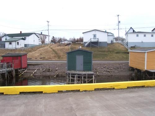 View of Fortune Fishing Sheds, Fortune, NL showing open spaces between sheds. Photo taken April 2006. ; HFNL/Andrea O'Brien 2006