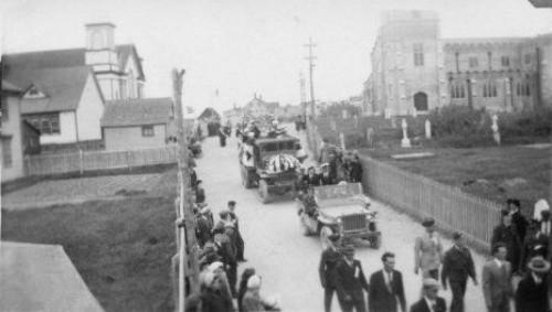 Memorial Day parade on Church Street, Bonavista, NL circa 1947, with former stone Christ Church building and Churchyard Cemetery on the right; Dave Dunn - Bona Photo Media Gallery, Town of Bonavista web site: www.bonavista.net