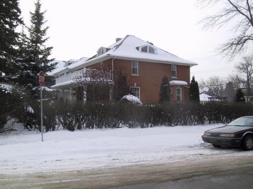 View of the front and side of the Hugh Duncan Residence from the intersection of 104 Street and 86 Avenue (March 2006); City of Edmonton, 2006