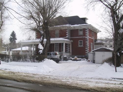 View of the front (north) and west facades of the Margaret Martin Residence, that face 84 Avenue (March 2006); City of Edmonton, 2006