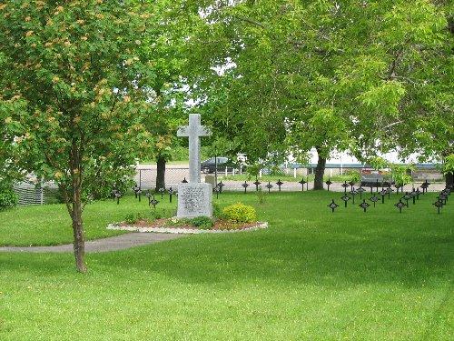 View of the Religious Hospitallers of St. Joseph Cemetery with the cross inscribed with their eulogy; Town of Tracadie-Sheila