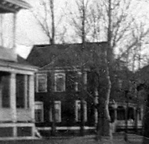 This photo, taken c1912, shows the Cleveland house in the distance. The dark paint colour is quite a contrast to its current white finish.