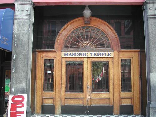 This is the elaborate entrance to the Masonic Temple with large wooden double doors and fan transom window, 2004; City of Saint John