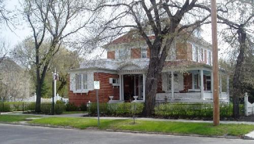 View of front facade featuring veranda, 2005.; Candice Lee, 2005.