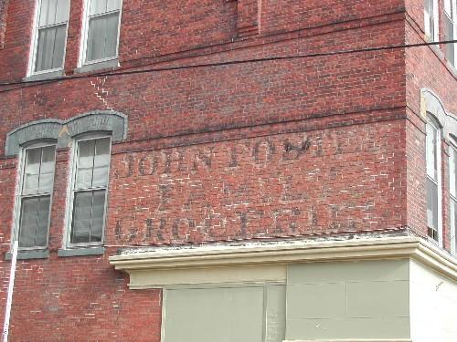 This photograph shows the historic sign that is painted on the side of the building, 2005; City of Saint John