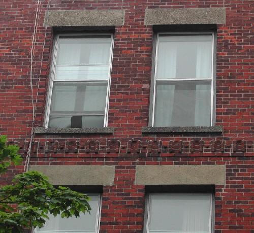 This image provides a view of the decorative band of brick just above the third floor windows, 2005.; City of Saint John