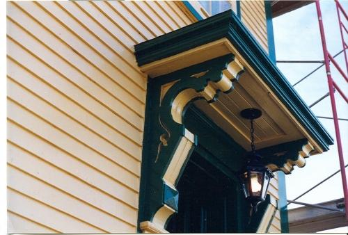 Detailed photo of O'Reilly House decorative brackets and large shelf located over front door.  Photo taken during restoration.; HFNL/ 2006