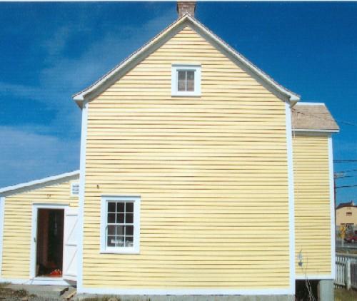 Exterior side view of Joseph and Selena Templeman House, Bonavista, showing rear extension, 2004; HFNL 2004