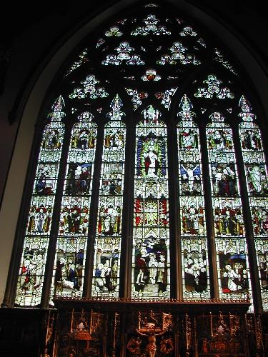This photograph shows the chancel. Beautiful stained glass windows and gilded carving which depicts the crucifixion, 2004; City of Saint John