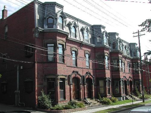 This photograph shows the contextual view of the building. The Wetmore Merreitt Residence is the second building from the forefront of the photo, 2004; City of Saint John