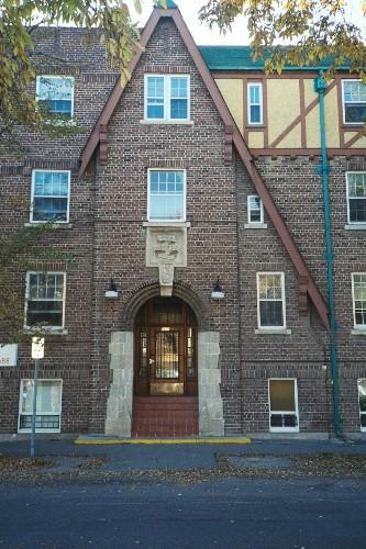 Main entrance of Kenora Apartments on 14th Avenue showing half-timbering and imitation Medieval thatching, 2005.; Ross Herrington, 2005