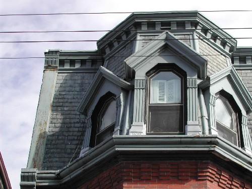This photograph shows the mansard roof with the turreted dormer, 2004; City of Saint John