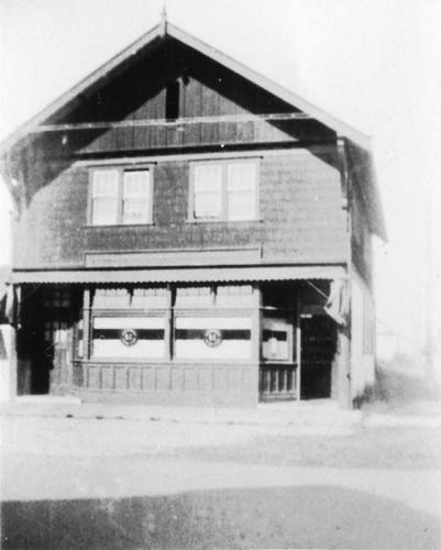 Exterior view of the Bank of Montreal Building during its time as a retail store for the B.C. Liquor Control Board.; Gwen Szychter, no date