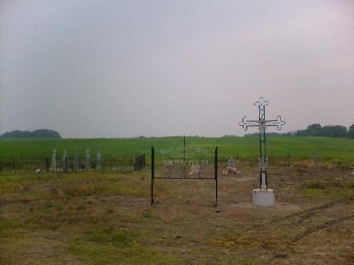 Signage and headstones at St. Mary's Greek Catholic Cemetery, 2006; Dwayne Yasinowski, 2006.