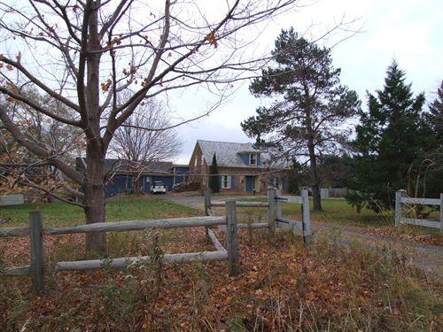 Parker Farm front and side elevation with view of summer kitchen and addition.; Heritage Division, NS Dept. of Tourism, Culture and Heritage, 2006.
