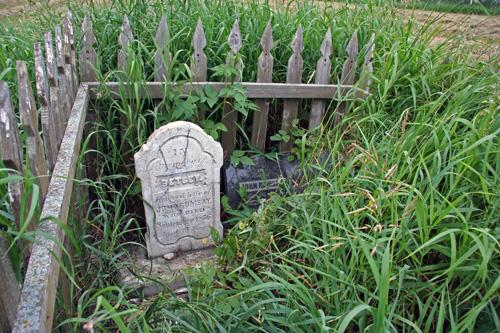 Detail view, from the south, of Betsey Ramsay's Grave, Riverton area, 2006, showing the gravemarker for Betsey Ramsay on the left and for John Ramsay on the right; Historic Resources Branch, Manitoba Culture, Heritage and Tourism, 2006