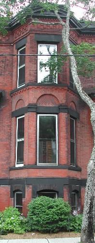 Edwin Peters Residence - This image provides a view of the two storey, semi-octagonal bay windows, 2005.; City of Saint John