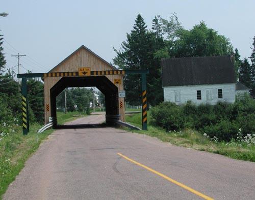 Former Gayton School - Distant view taken from the northwest showing the location of the school near the Gayton covered bridge that spans the Memramcook River.; Gérard LeBlanc