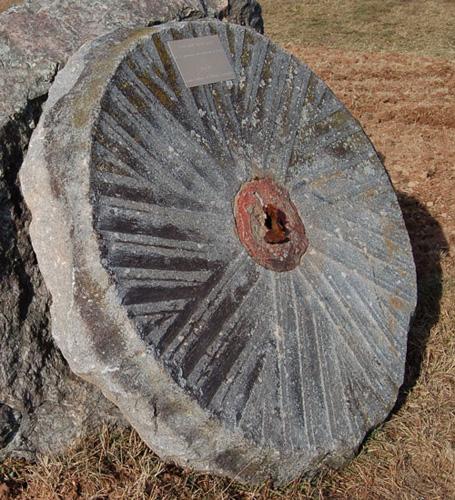Pascal Brun House - grain mill grindstone; Village of Cap-Pelé
