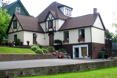 The east side of 126 Brunswick Street illustrates the Tudor Revival Style; Restigouche Regional Museum, Dalhousie