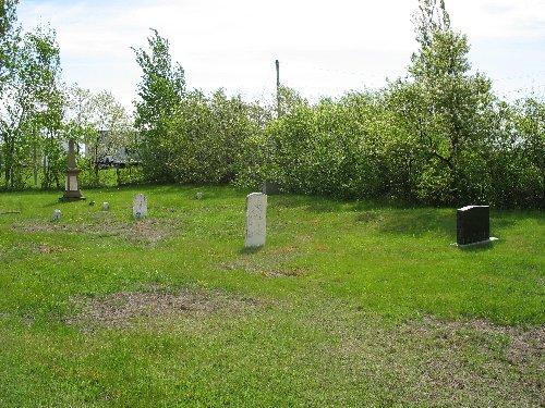 View of the front of the cemetery - some tombstones are still visible; Town of Tracadie-Sheila