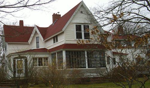 Front and side façades - House positioned on corner lot; Town of Sackville