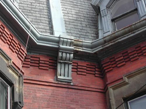 This photograph shows the corbel bands and brackets, 2004; City of Saint John