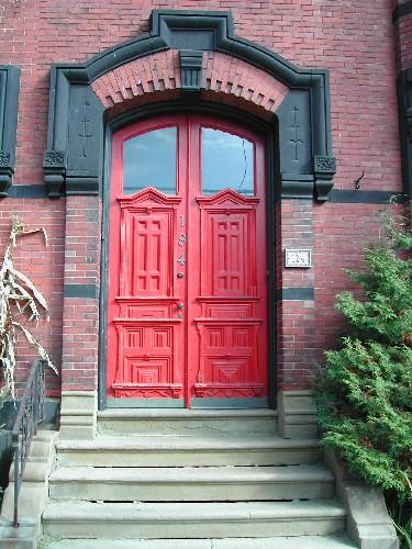 This photograph shows the red door and the elaborate entranceway, 2004; City of Saint John