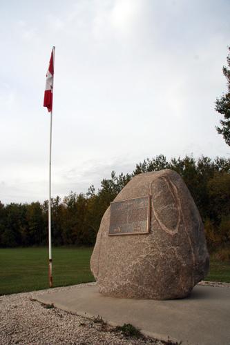 Site view, from the northeast, of the boulder bearing the commemorative plaque at the Opawaka School Site, Miami area, 2006; Historic Resources Branch, Manitoba Culture, Heritage and Tourism, 2006