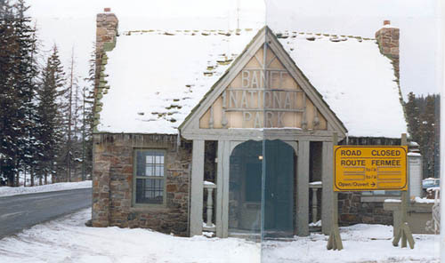 Façade of Building 2, showing the front porch, the gable end of which frames the words “Banff National Park”, which protects the main entrance, 1985.; Parks Canada Agency / Agence Parcs Canada, 1985.