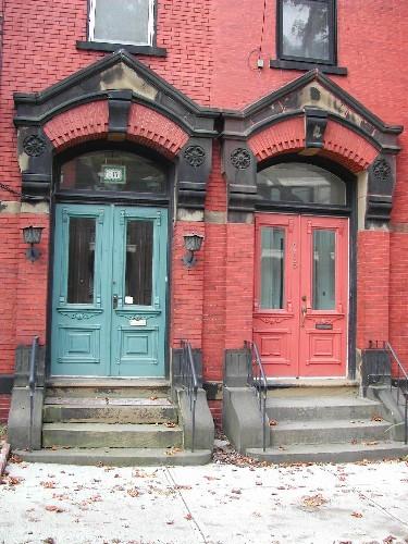 This photograph shows the elaborate entrance and the complementary style of this residence with the neighboring building to the north in this four building complex, 2004; City of Saint John