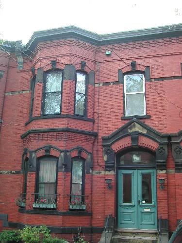 This image shows a full view of the John Thomson Residence with  its elaborate entrance and 2-storey bay, 2004; City of Saint John