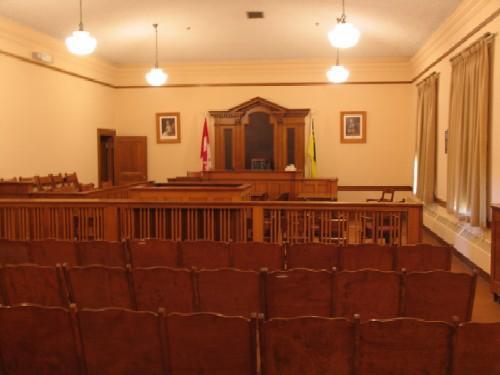 Interior image of the Shaunavon Courthouse highlighting the wood trim in the court room, 2006.; Government of Saskatchewan, Bernard Flaman, 2006.