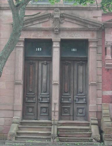 This photograph shows the pedimented entablature with pronounced keystone above the dual entries, 2005.; Cityy of Saint John