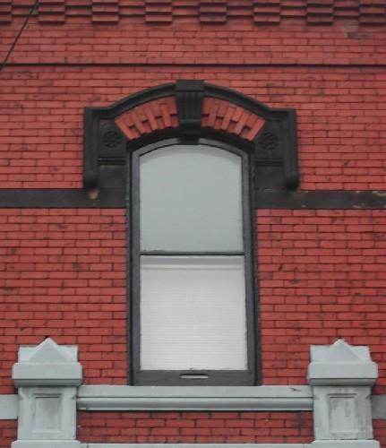 This image provides a view of the second storey segmented arched center window, 2005.; City of Saint John