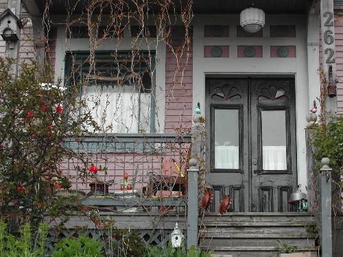 This photograph shows the paired wooden doors and the porch, 2005.; City of Saint John